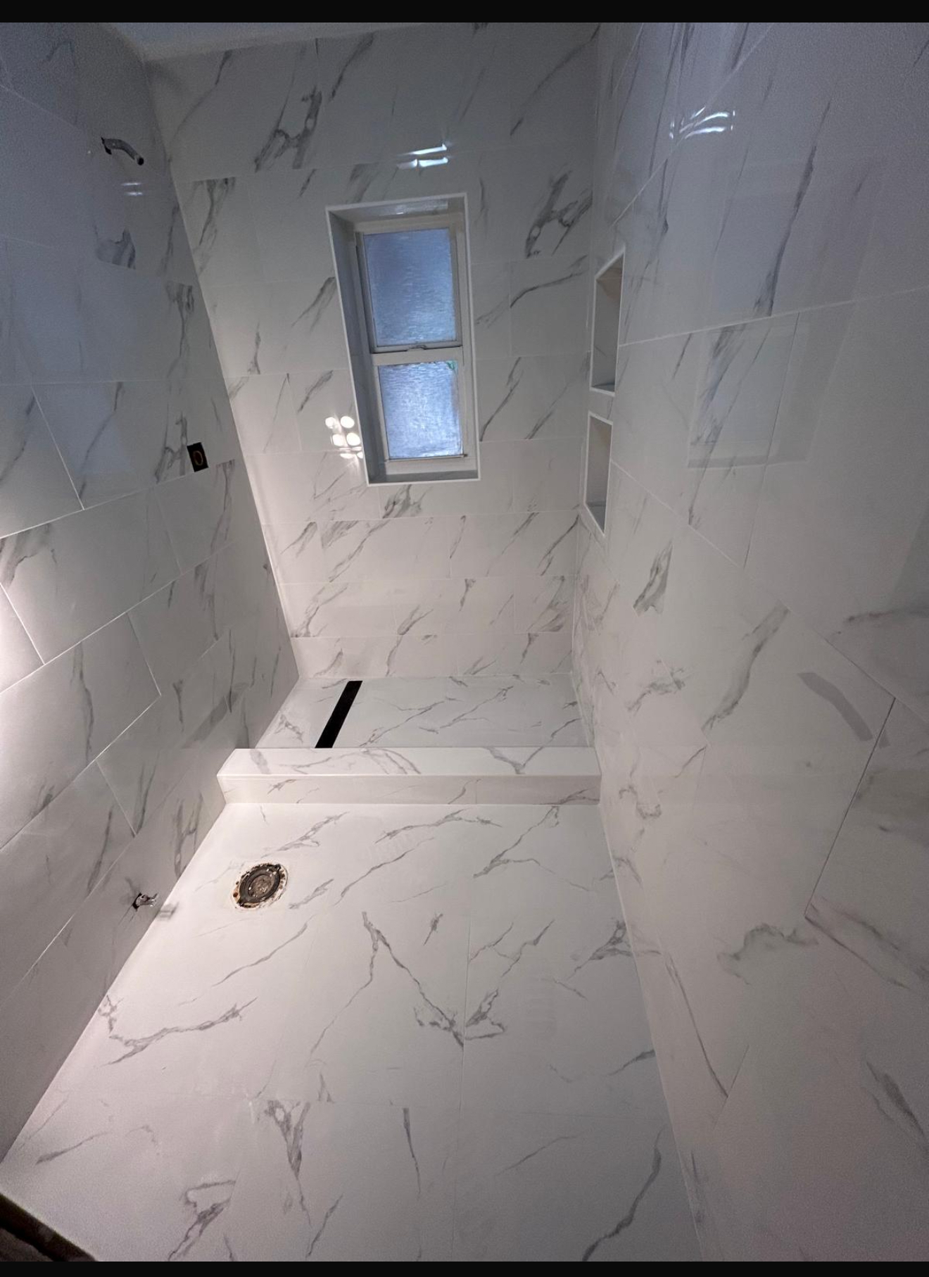 Luxury marble bathroom renovation with modern fixtures