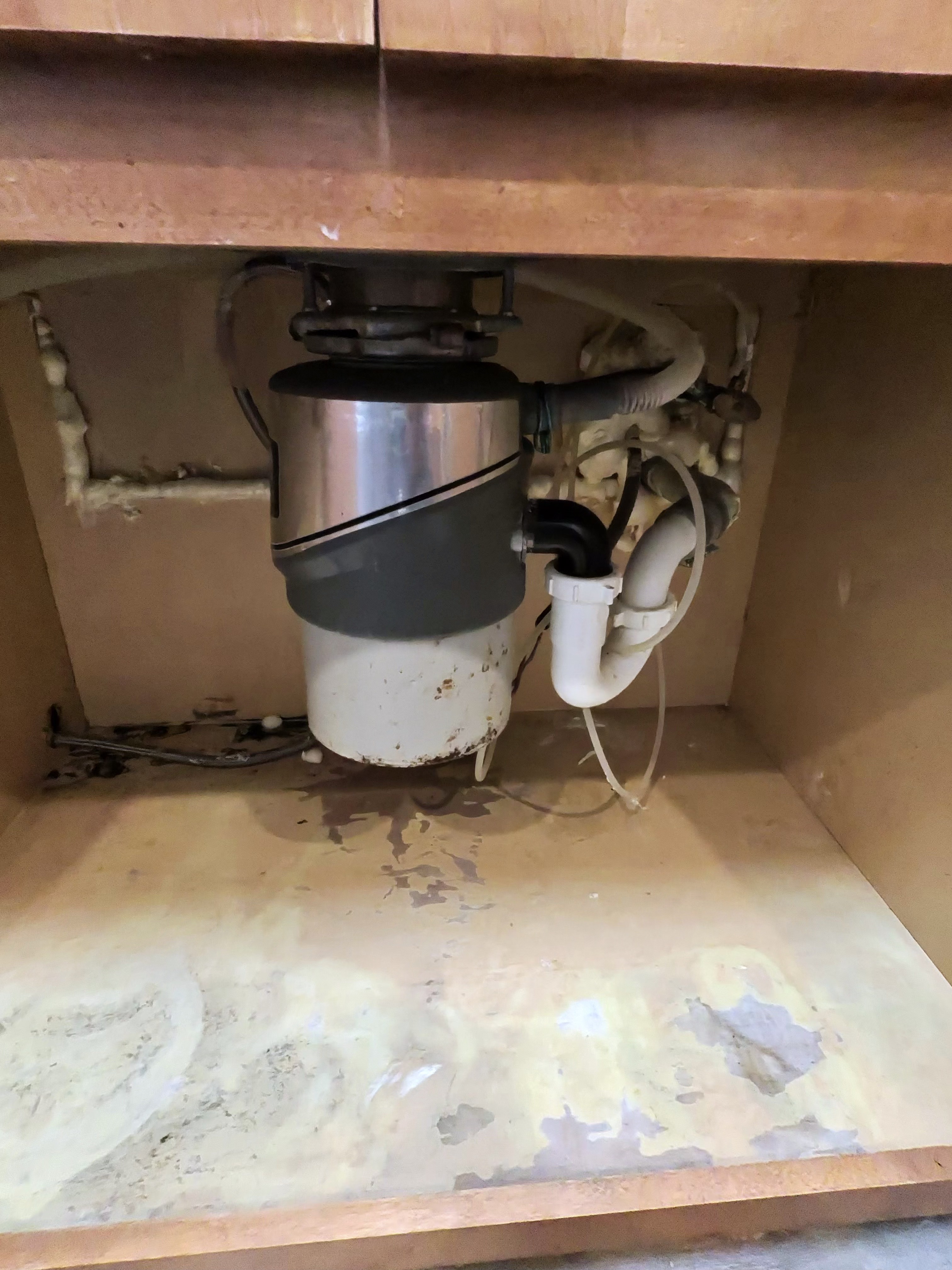 Under-sink garbage disposal installation and plumbing connections