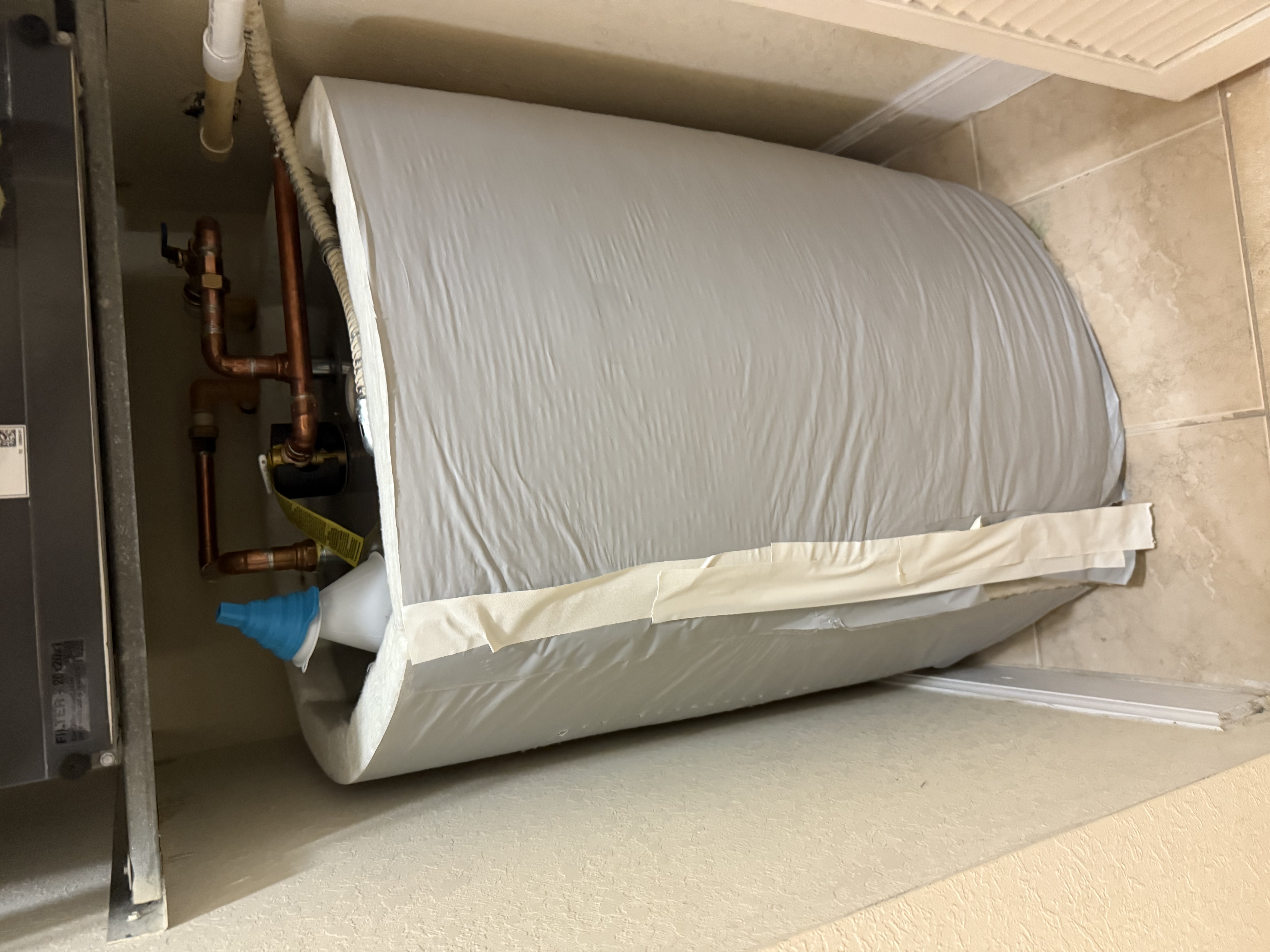 Professional water heater installation with copper piping